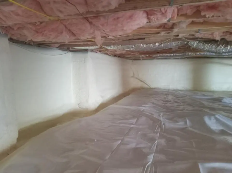 Crawl space encapsulation with closed-cell spray foam for Commercial Roof Restoration in Gonzales